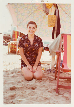 Vintage smiling woman on the beach