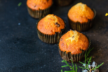 muffins cupcakes homemade baking cakes on the table christmas lights new year treat tasty serving size portion top view copy space for text food background rustic