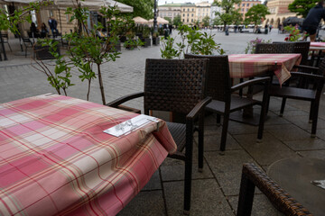 Restauant table in Cracow Main Square marked as disinfected 