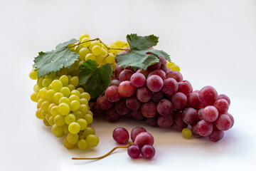Yellow and red grapes on a white background