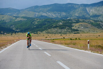 Fototapeta premium triathlon athlete riding bike
