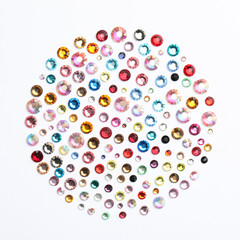 Different beautiful gemstones on white background, top view