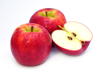 Ripe red apple fruit with apple half on white background.	