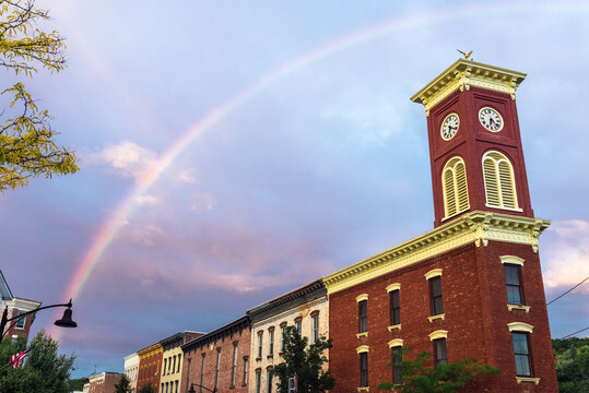 rainbow over a village clocktower
