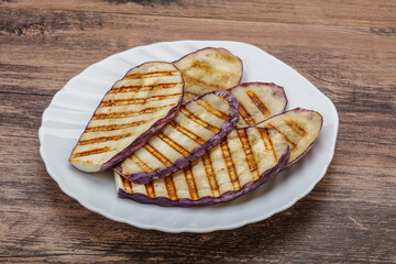 Grilled graffiti eggpant slices with oil