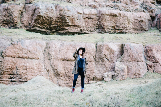 Woman posing in mountain meadow