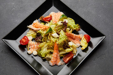 Fresh seafood salad served with prawns (shrimps ). Top view