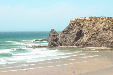Tourist enjoying delightful beach of Odeceixe at Alentejo coast in Portugal
