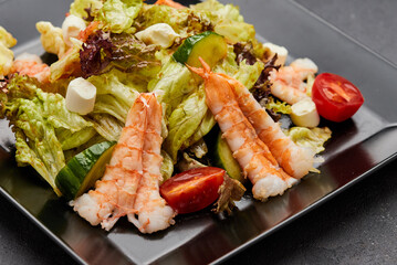 Fresh seafood salad served with prawns (shrimps )