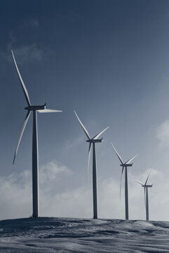 Spinning Wind Turbines On Wind Farm