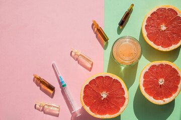 High dose vitamin C, ampule for injection, face cream, syringe and fresh juicy orange fruit slides....