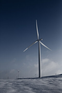 Spinning Wind Turbines On Wind Farm