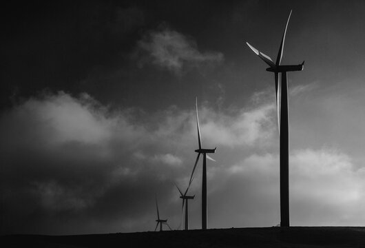 Spinning Wind Turbines On Wind Farm