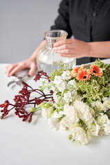 Series, step by step installation of flowers in a vase. Flowers bunch, set for home. Fresh cut flowers for decoration home. European floral shop. Delivery fresh cut flower.
