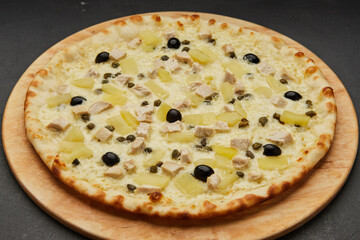 Delicious Italian pizza Hawaiian with pineapple and chicken