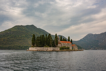 Fototapeta na wymiar Saint George (Sveti Juraj) island and church near Perast in the Bay of Kotor, Montenegro. One of the two islets off the coast of Perast