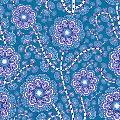 Mehndi leaves & flowers pattern grouped into twisted branches. Seamless floral texture with traditional paisley decorative element. Blue colored almond-shaped ornament. Indian textile with mandala