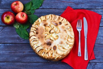  Apple Pie on a wooden background. Festive Delicious Food and Fresh apples on red napkin, Yummy pie. Concept harvest fresh apples. Copy space, flat lay. homemade apple pie