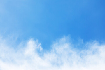 Naklejka na ściany i meble Fantastic soft white clouds against blue sky and copy space.