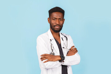 medicine, profession and healthcare concept. African american male doctor with stethoscope in white coat on blue background