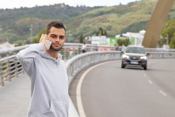Fototapeta premium man on the road calling on the phone