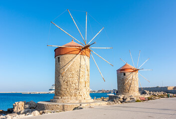 Fototapeta na wymiar Windmills in Mandraki harbor, Rhodes island, Greece