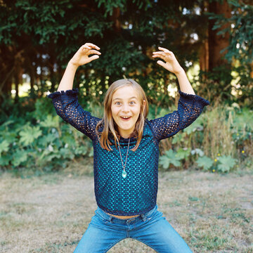 Nine year old girl acting like a silly monkey on the last day of summer vacation