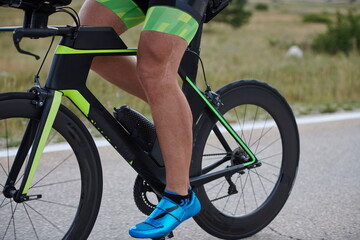 Fototapeta na wymiar closeup of triathlon athlete riding bike