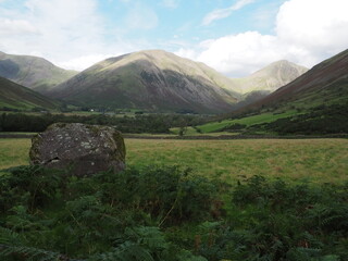 View from the bottom of scafell pike with a boulder in the left corner, lake district in cumbria