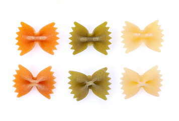 Color Farfalle - dry pasta isolated on a white background. A variety of types and forms of Italian pasta.