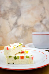 Pastiile with marmalade slices and a Cup of black tea