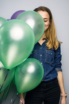 Smiling woman with balloons