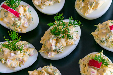 a landscape birds eye view of some freshly made stuffed boiled eggs on a plate