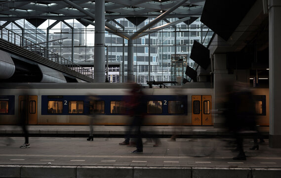 people walking on railway platform