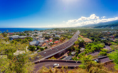 Magnificent panoramic view of the town of Saint-Paul crossed by the RD1 departmental road