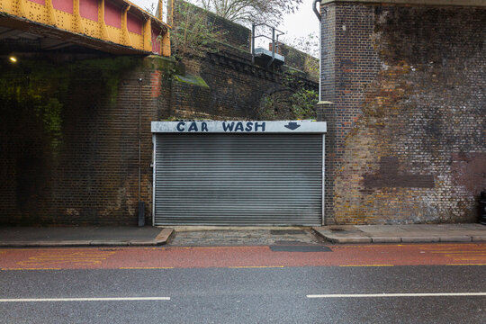 Dodgy carwash company with a rolling shutter.