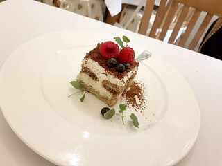 Tiramisu cake with raspberry and blueberry