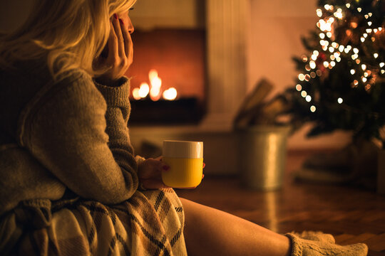 Woman Drinking Tea on Christmas Eve