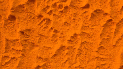Solid orange color plaster concrete wall texture background.