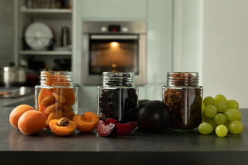 Dried fruits and fruit chips along with the fresh fruit of which they are made.