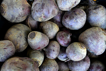Ripe pile of beets for sale at farmers market. Background
