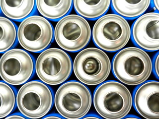 empty blue aerosol cans in factory 