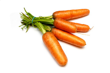 Fresh carrots lying on a white background, isolated.