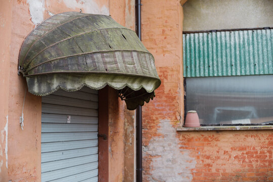Old awning and shop shutter