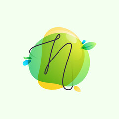 N letter logo placed on green watercolor blots.