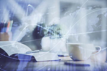 Multi exposure of forex graph drawing and desktop with coffee and items on table background. Concept of financial market trading