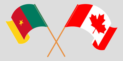 Crossed and waving flags of Cameroon and Canada