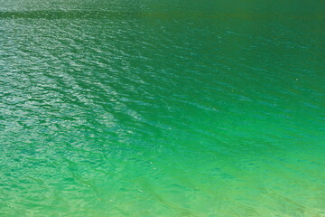 View from above on an alpine  lake with clear blue water