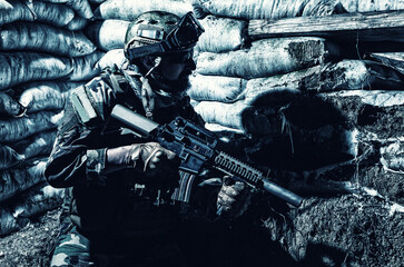 Navy SEALs fighter, army soldier in combat uniform, goggles and battle helmet at night watch,...