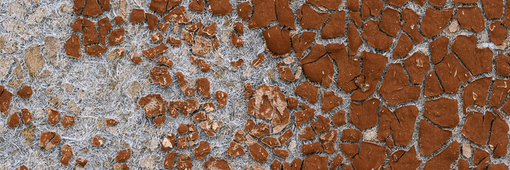 Texture of old cracked artificial leather. The surface of the dried leatherette with lots of cracks and pieces of brown material. Faux leather texture. Wide panoramic background for design.